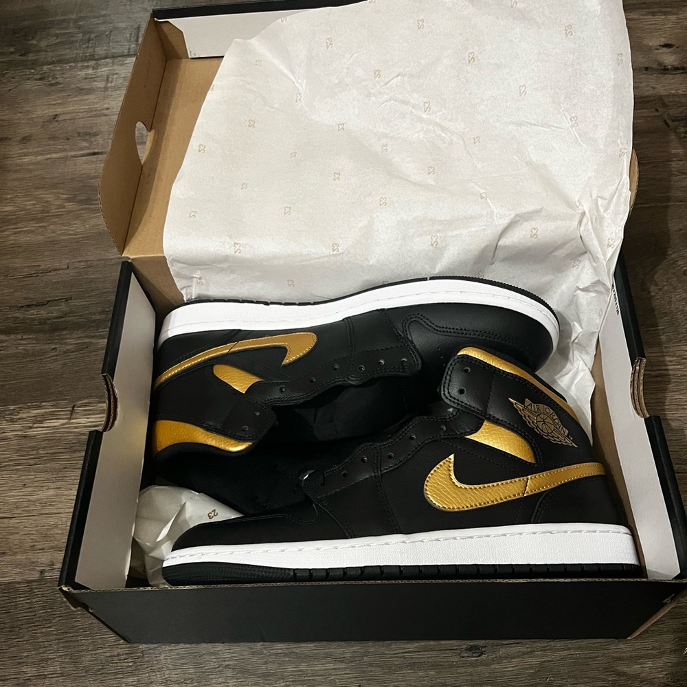 Jordan 1 black and gold sneaker shoe. New with box. Size 10.